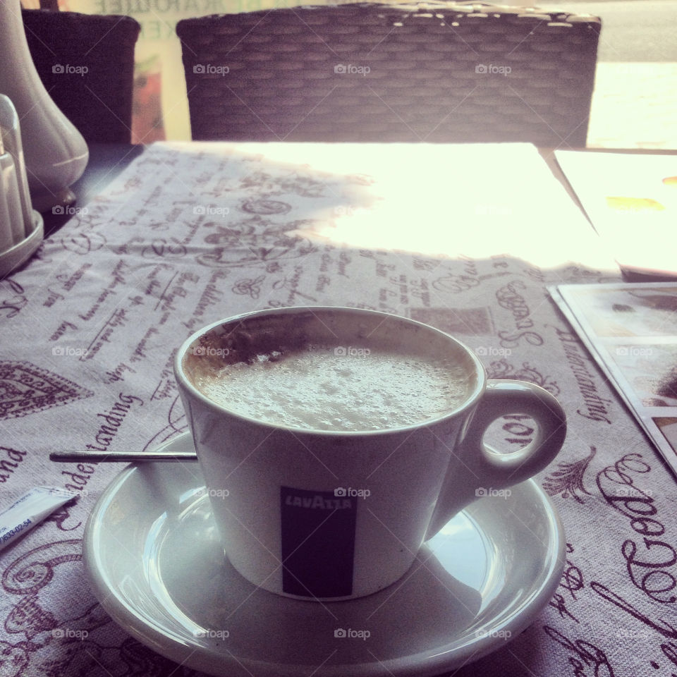 Morning cup of cappuccino on a table