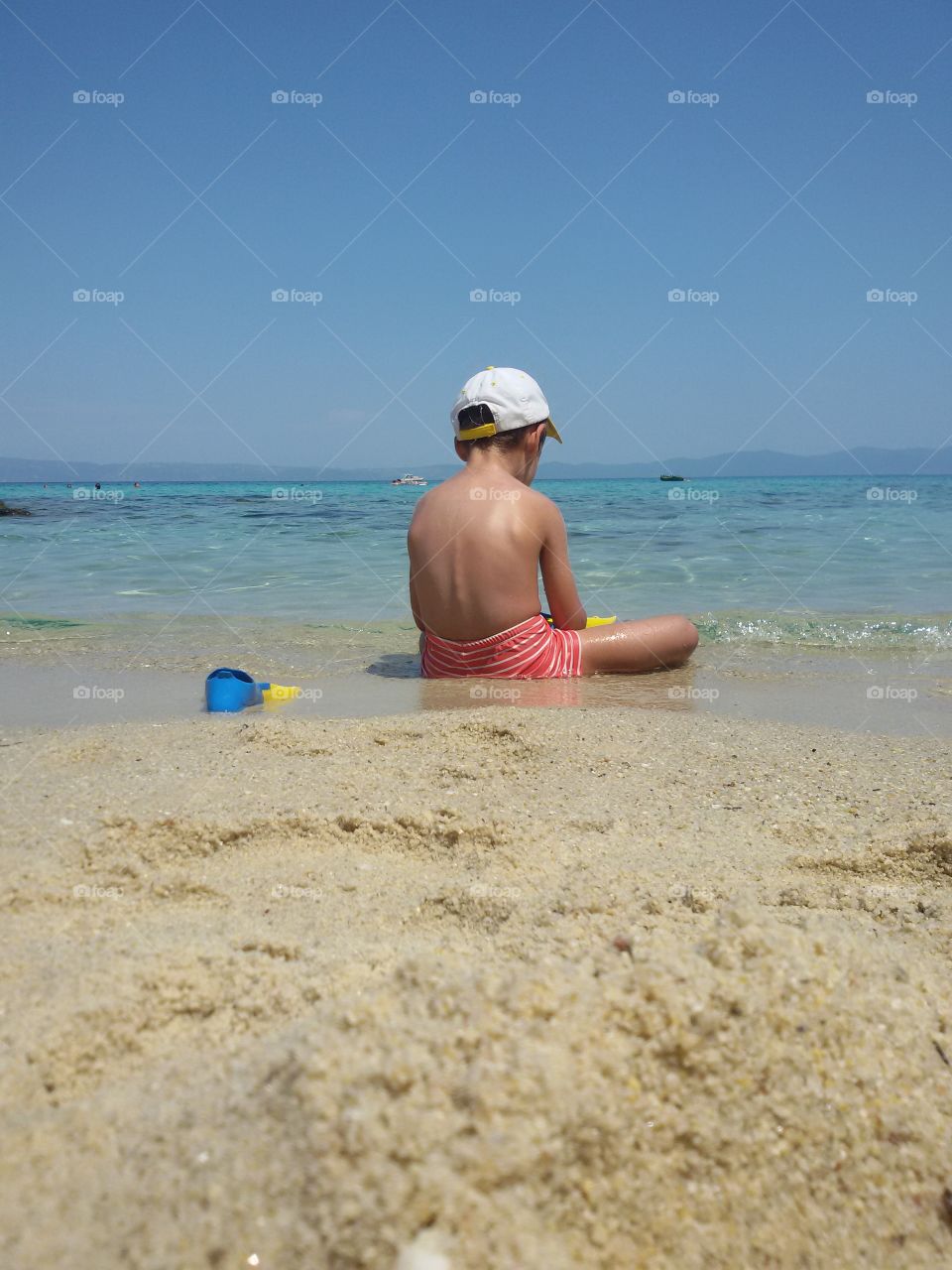 Small boy playing in the water