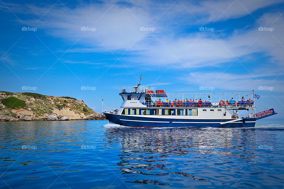 Holiday trip. Touristic boat on the waters of Rhodos Greece