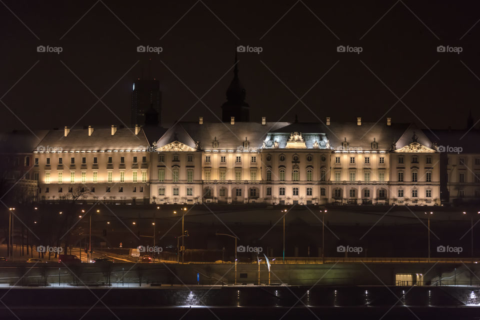 Royal Castle by the Vistula river in the Warsaw city at night
