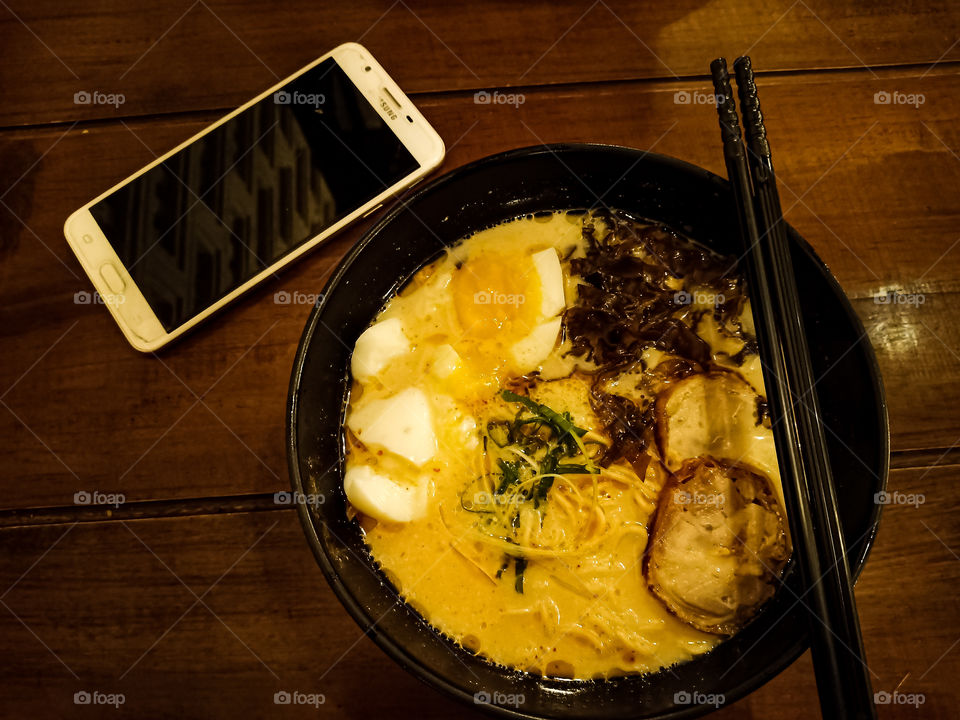 Enjoy the ramen when the rains is fall down. It's hot, warm, and spicy. Really delicious with the milky soup, tested creamy, yummy! The egg yolk really soft and tender, so cream.