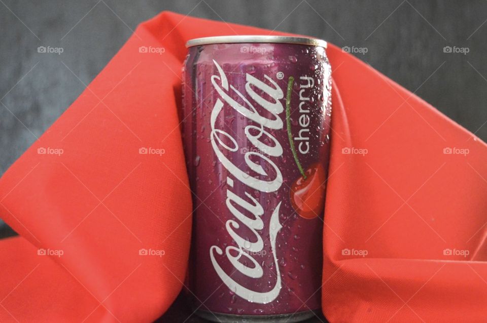  Cherry Coca-Cola with a red and rustic background