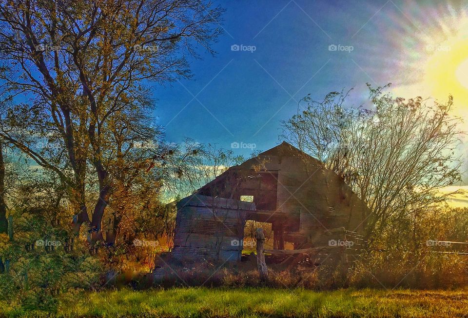 Sunset over old barn 