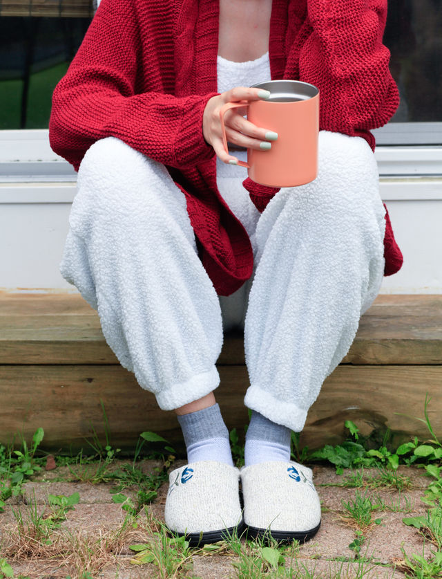 Enjoying morning coffee with acorn slippers on