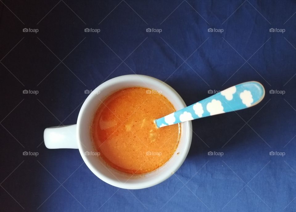 Orange, blue, tomato soup