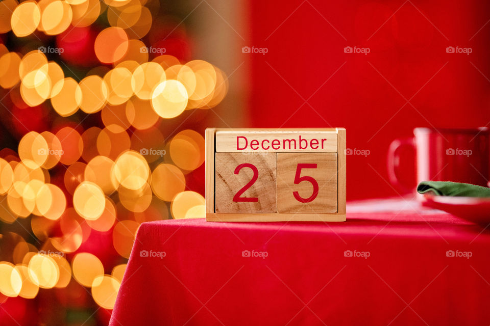 Christmas background with wooden block calendar with the date of December 25