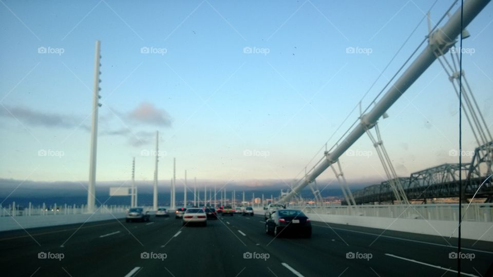 san Francisco Bay Bridge, driving with a beautiful view of the horizon.