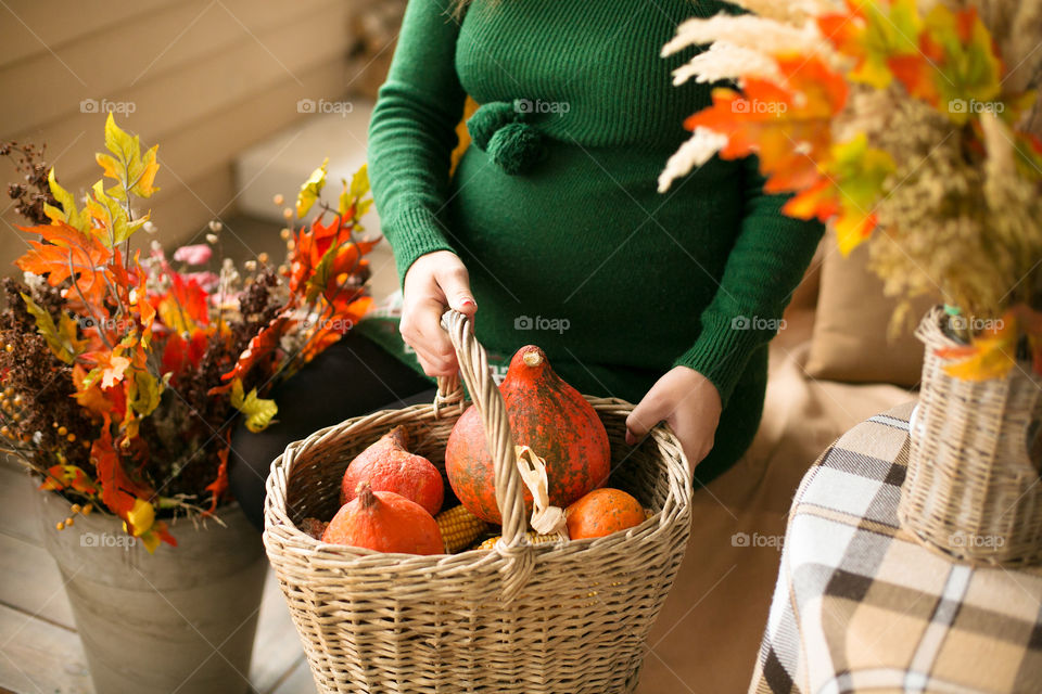Pregnant woman with basket of fruits