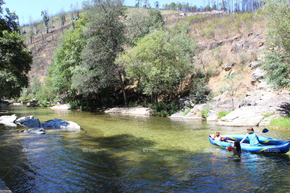Down the river by boat, kids, fun and joy 