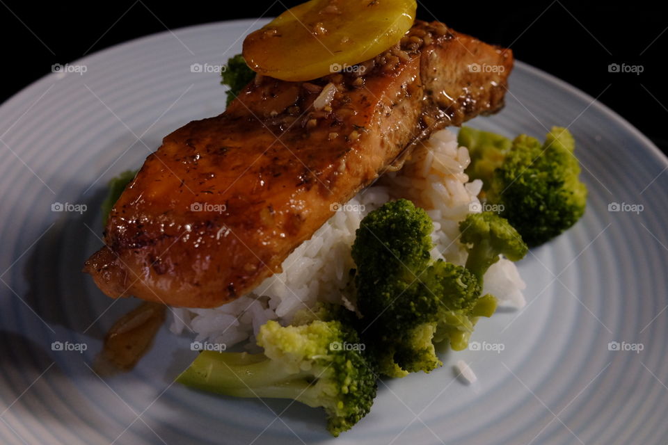 Teriyaki salmon on rice and vegetables