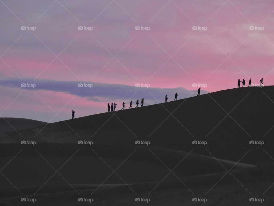 Silhouette of people on mountain