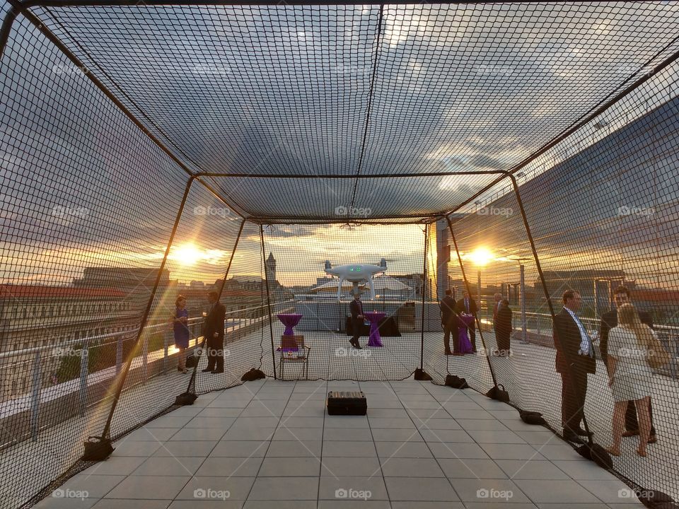 sunset on the roof of the Newseum while flying a phantom 4 drone inside a cage