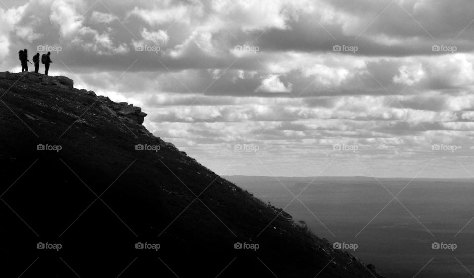 Hikers looking out from Städjan peak, near Idre, Dalecarlia, Sweden