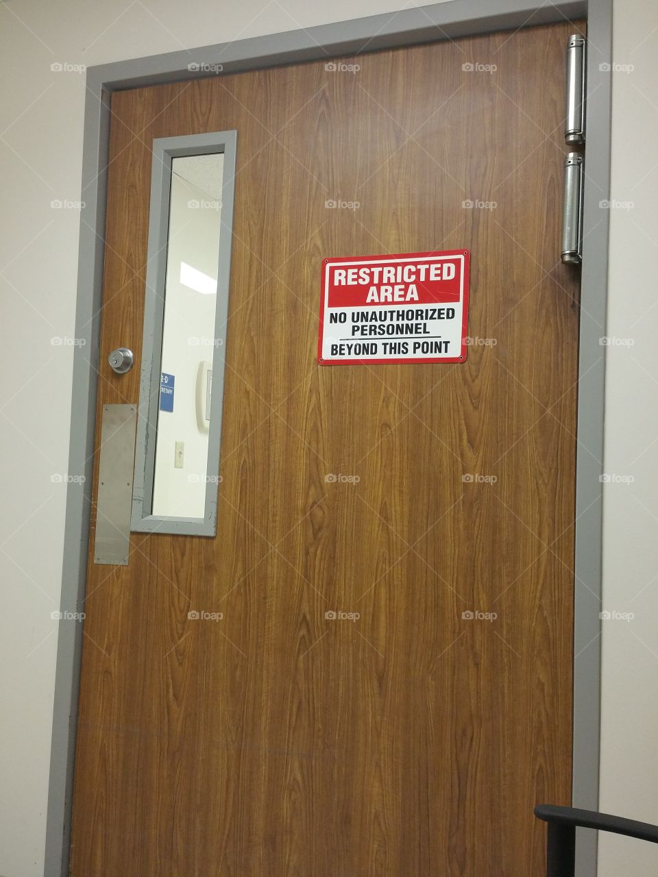 door with No Unauthorized Personnel Beyond this point