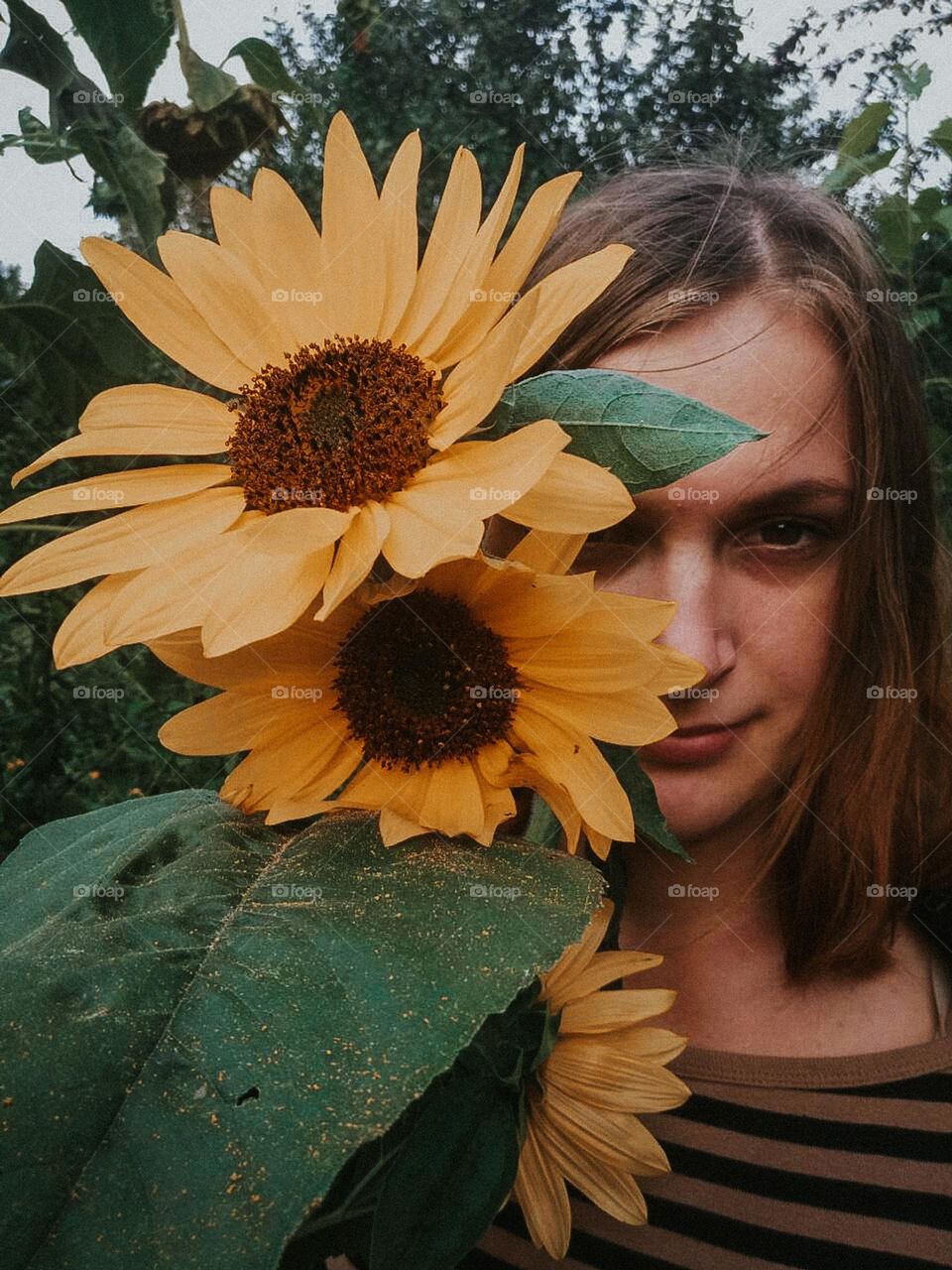 Portrait with yellow sunflowers