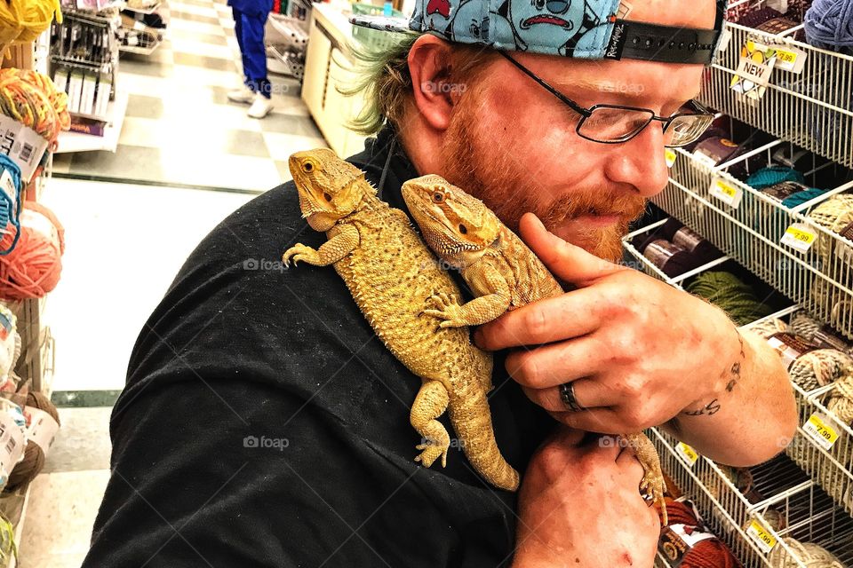 Just a man and his lizards out shopping... 