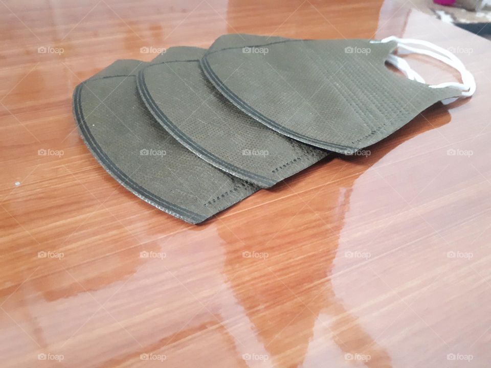 a display of brown masks on ceramic for sell