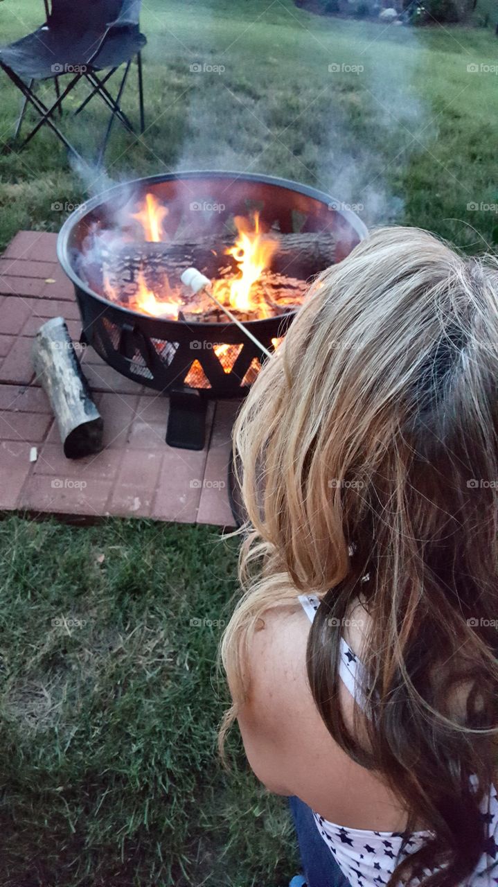 Roasting marshmallows at the firepit.