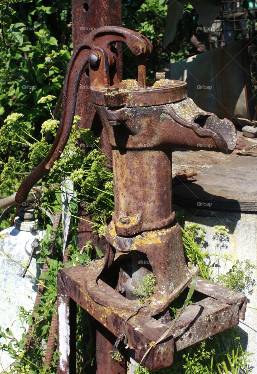 An old rusty water pump