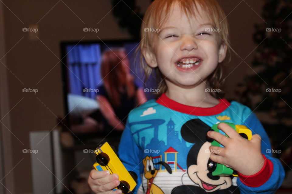 He is ultra happy in his Mickey Mouse pjs and playing with his new cars :)