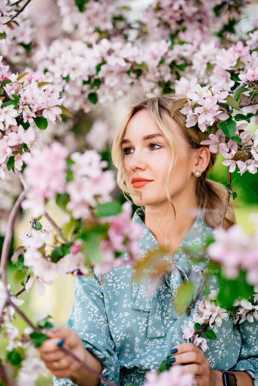 Portrait of beautiful woman with blond hair looking away