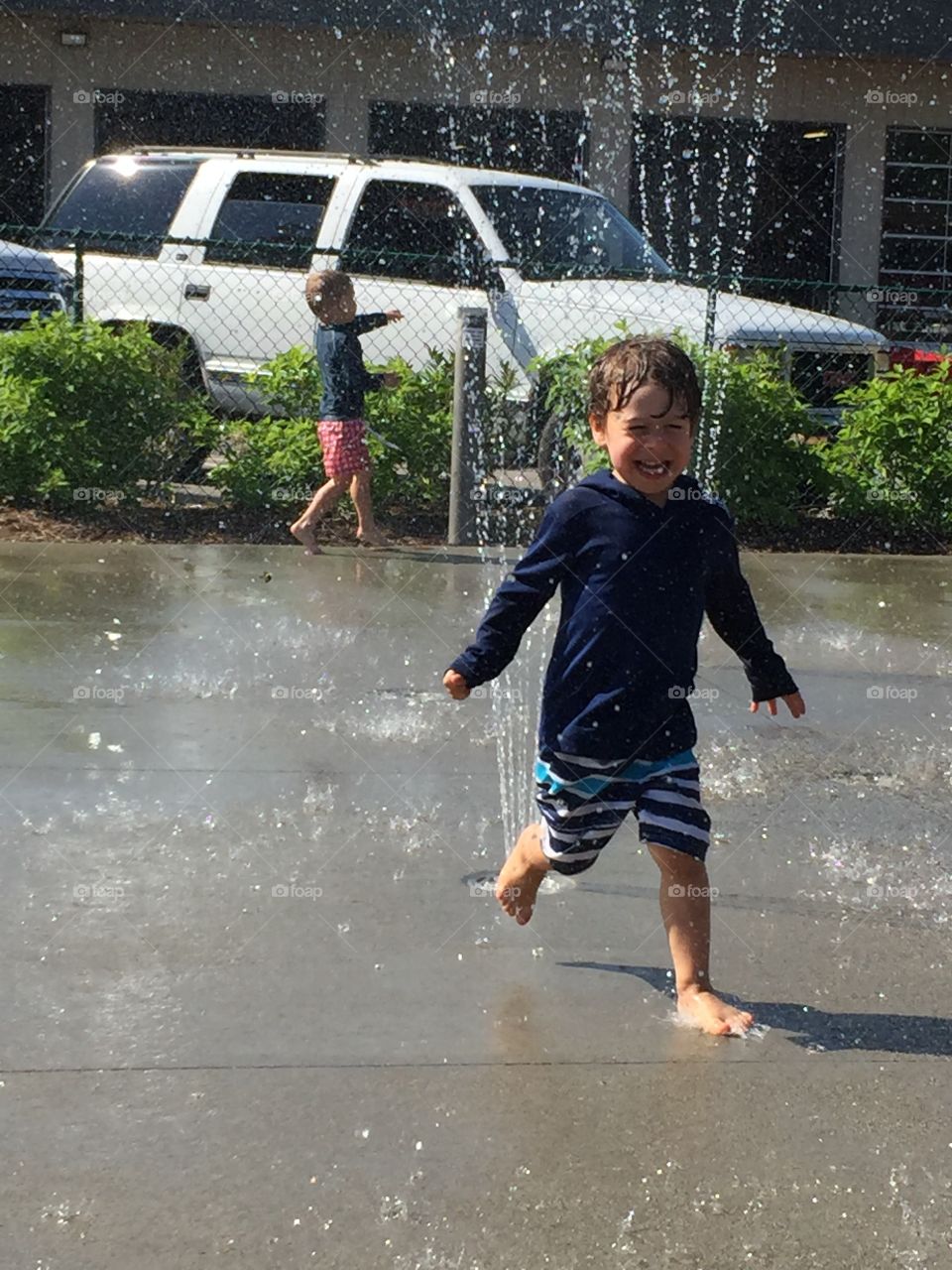 Playing in the Fountain in the Summer