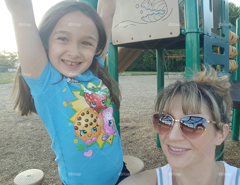 Happy mother and daughter in park