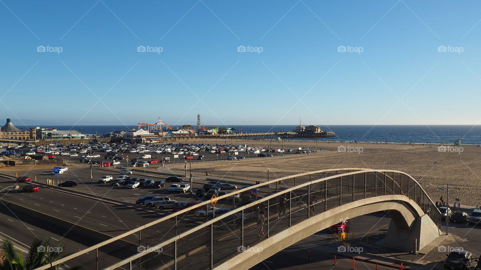 Santa Monica Pier, California. Santa Monica panoramic beach scene, pier, sand, tourist, sunset
