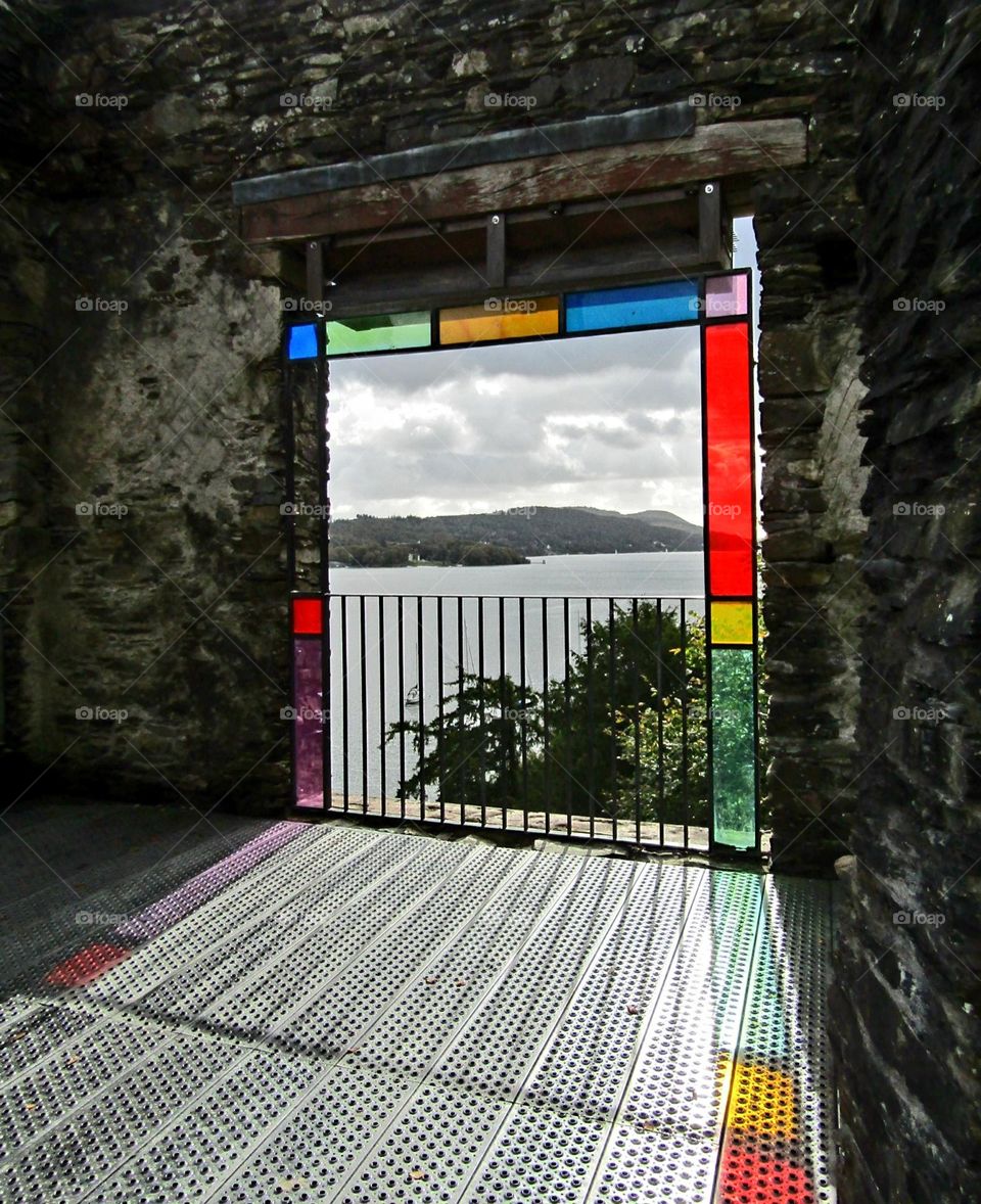 stained glass window frame overlooking lake windermere