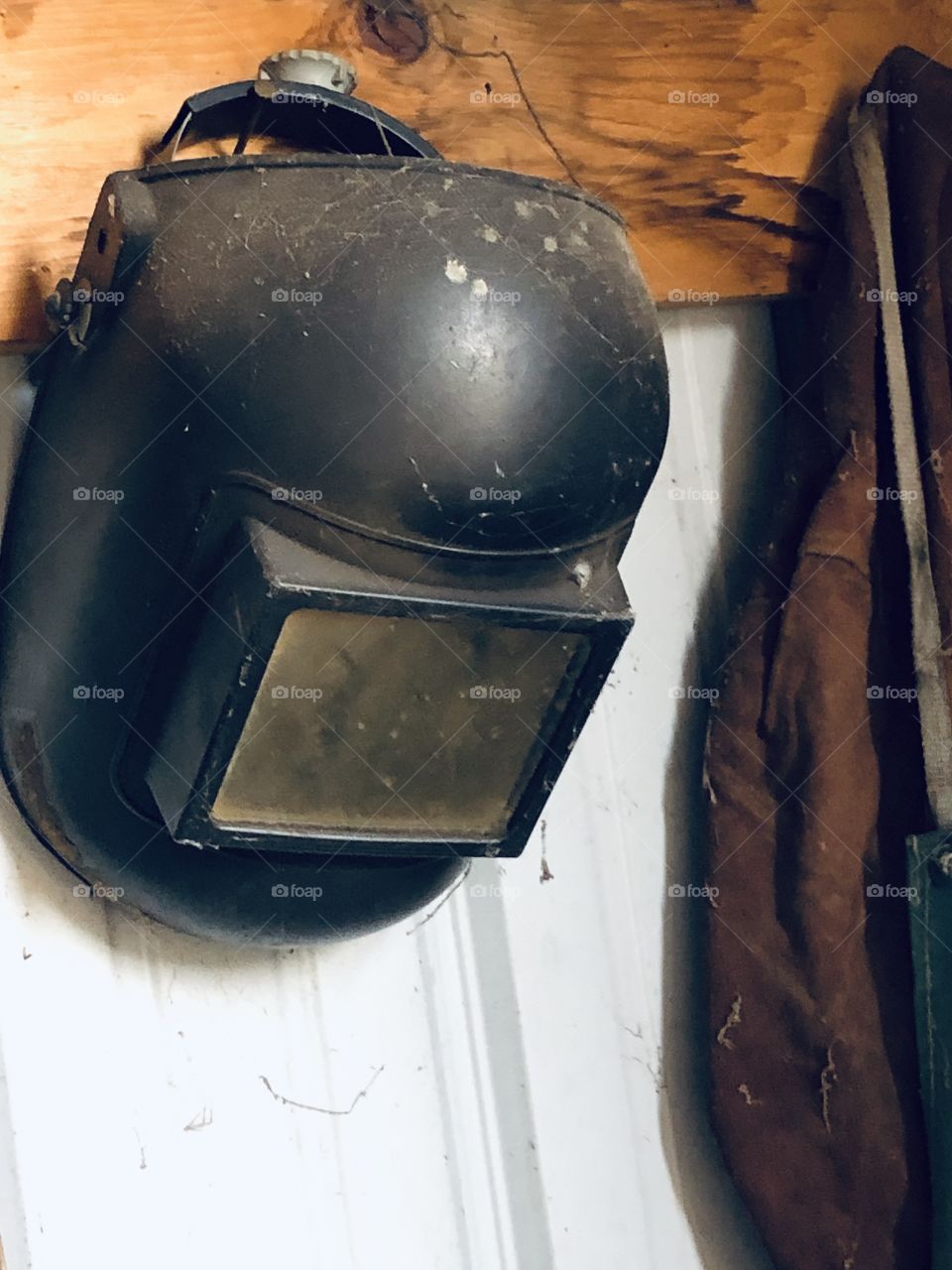 Welding face shield and old coat 