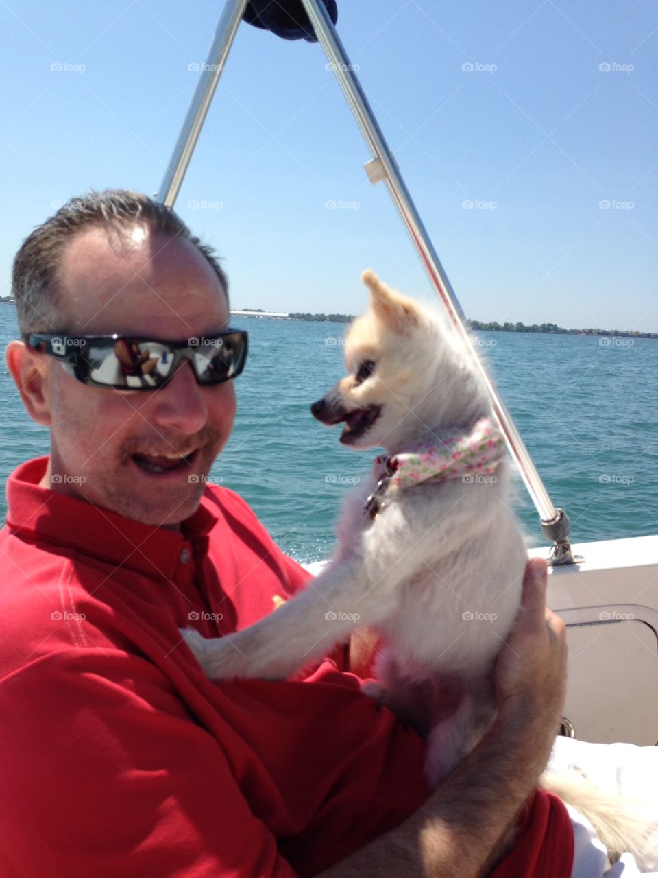 Dad with dog. This is my dad with my little adorable doggie named Fox on our boat