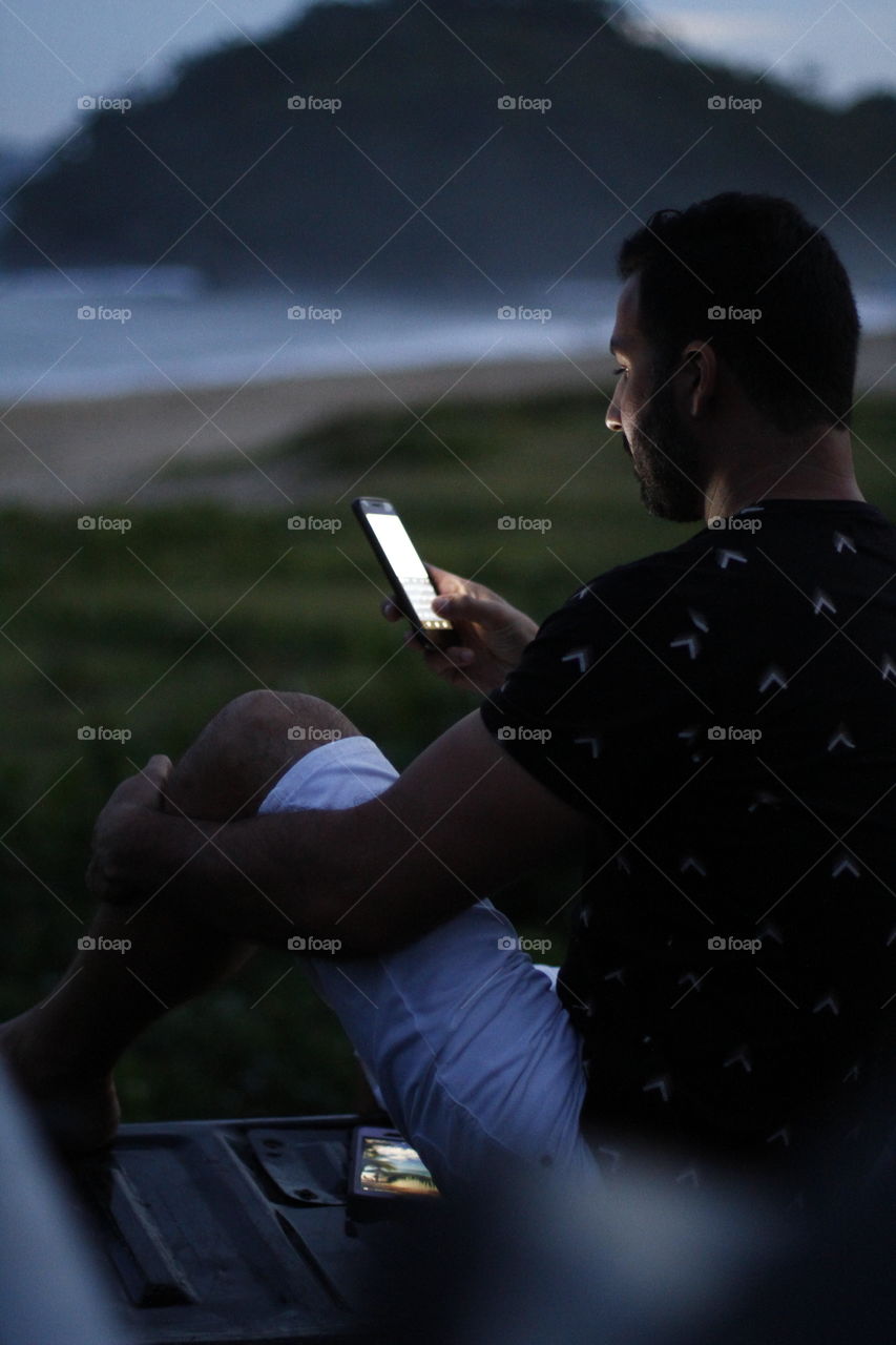 man sitting in his truck