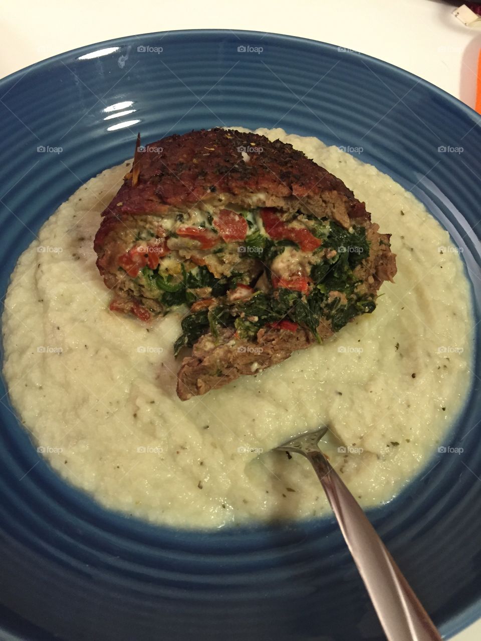 Steak roll me to heaven. Steak rolled with Gorgonzola cheese, roasted red peppers, and spinach served over mashed cauliflower 