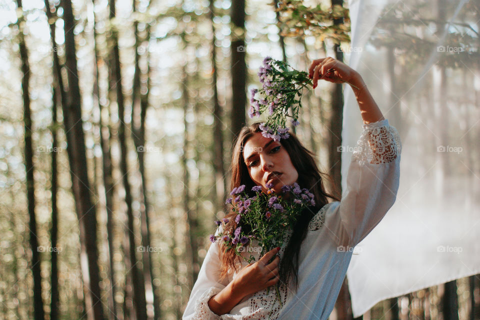 holding autumn flowers