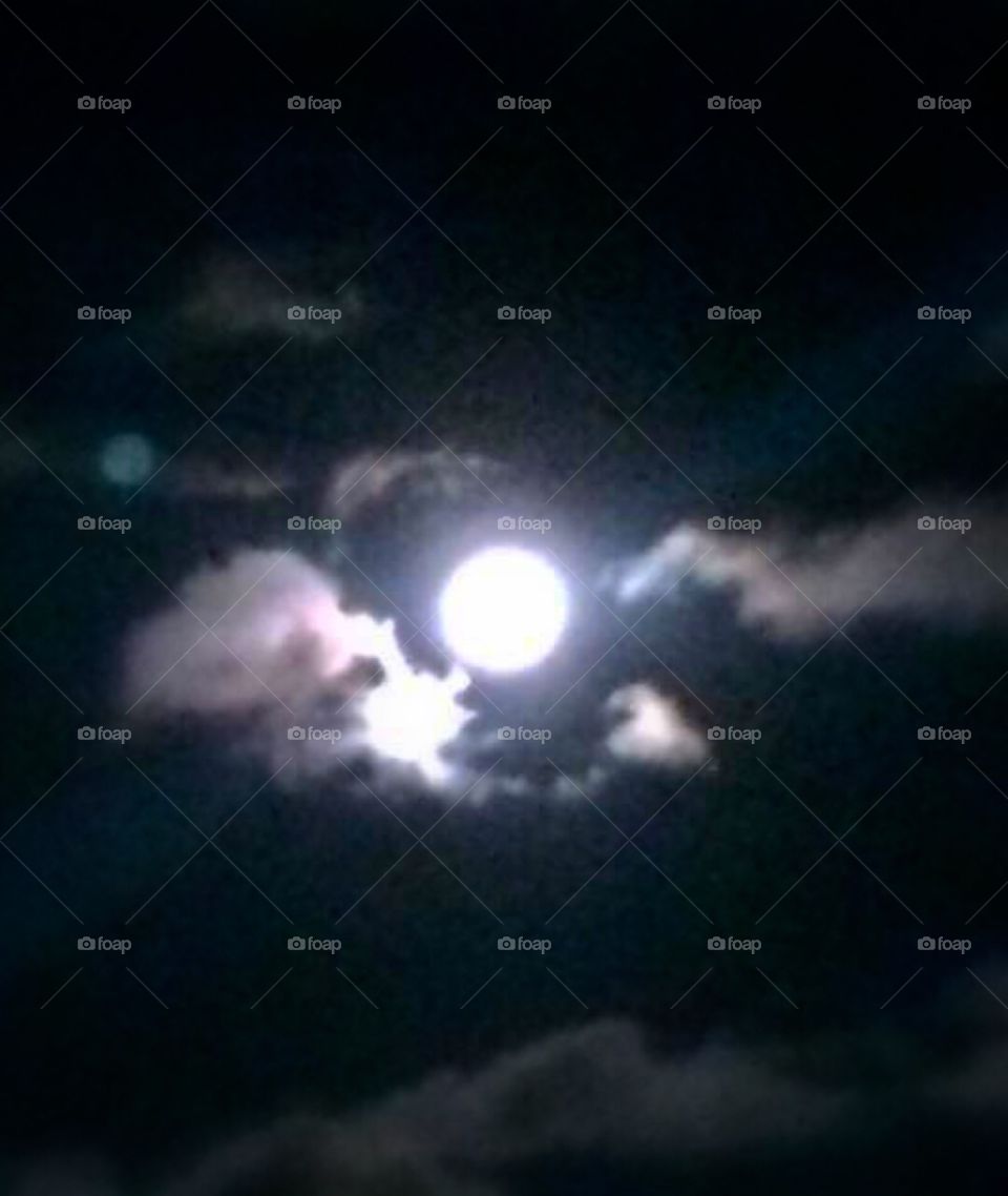 The clouds parted briefly to reveal the bright full moon allowing me to take this shot