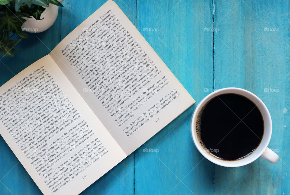 Reading book and coffee flatlay