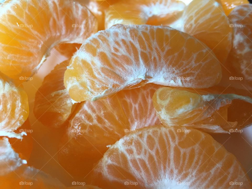 Freshly peeled orange slices