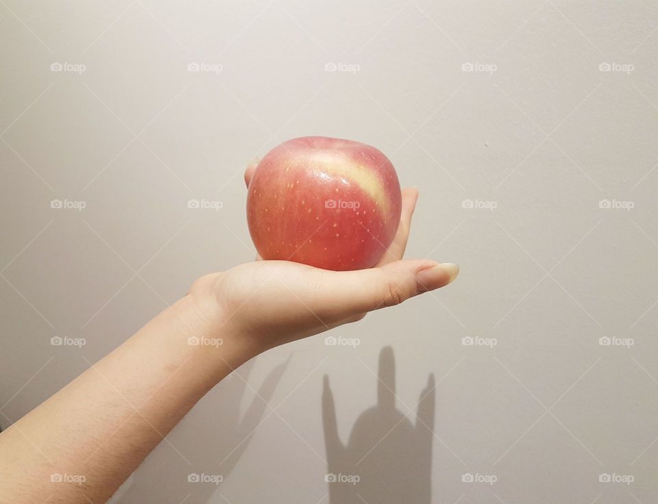 An apple in hand