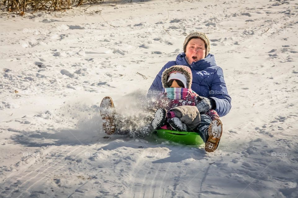 Sliding from a snowy hill