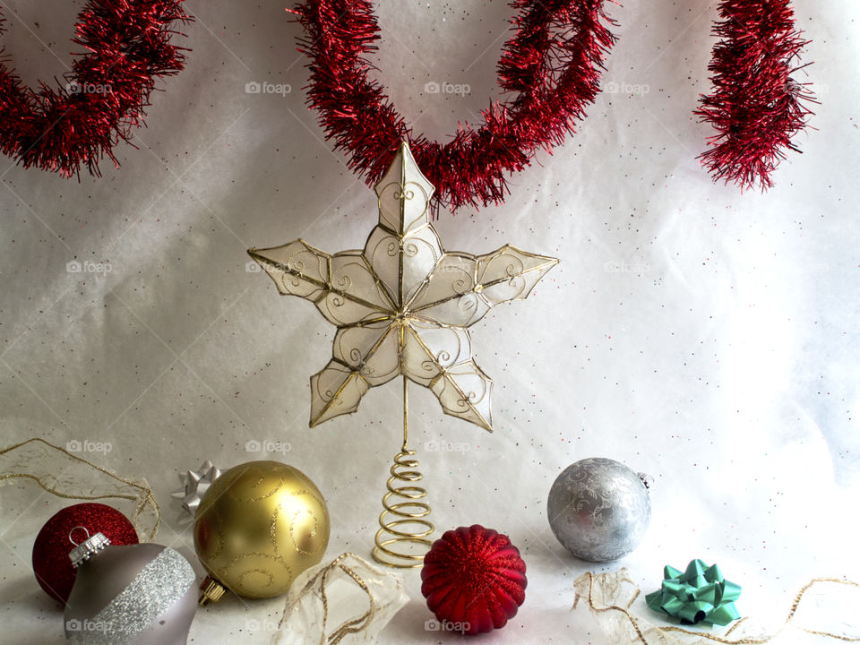 Christmas decorations on a white sparkly background.