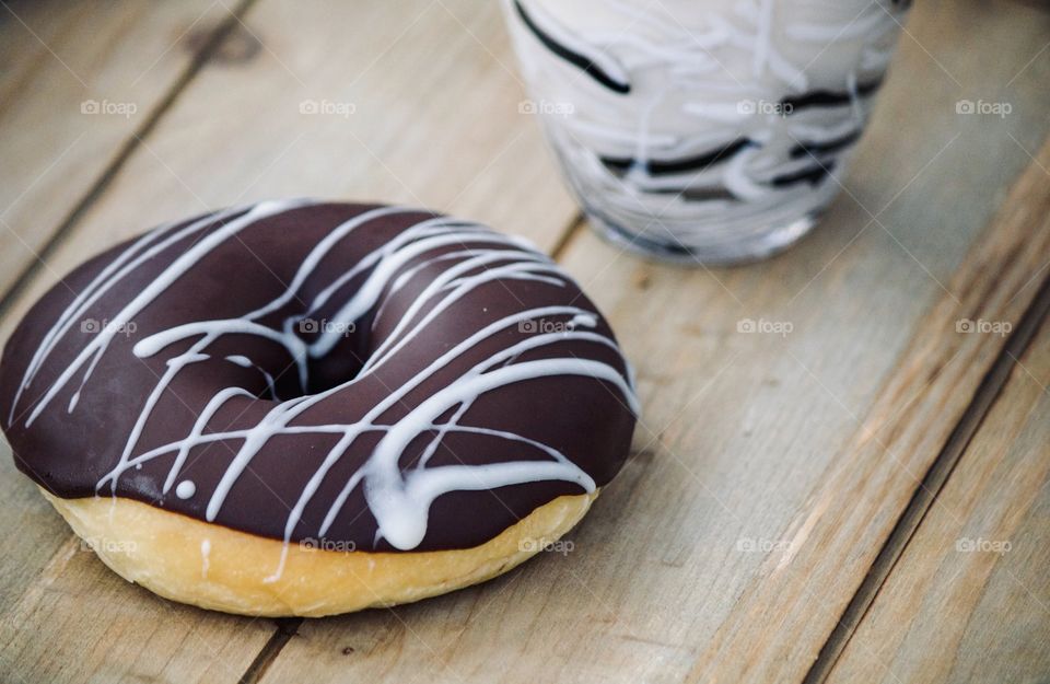 Chocolate donut with milk