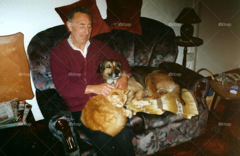 Dad surrounded by his animals 
