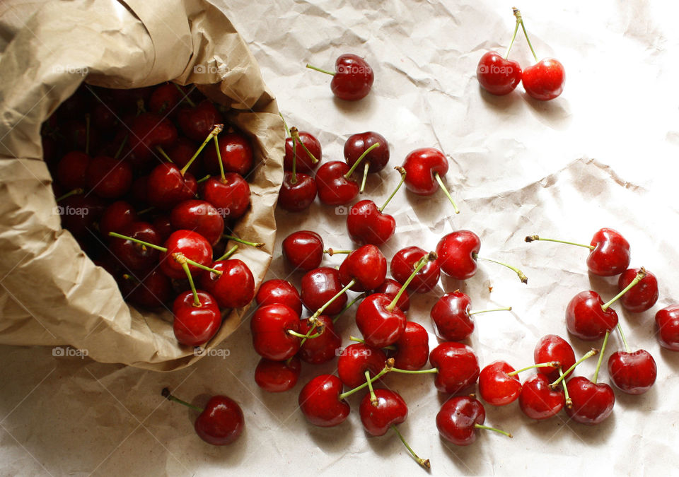 Cherries on a paper background. Summer fruits.