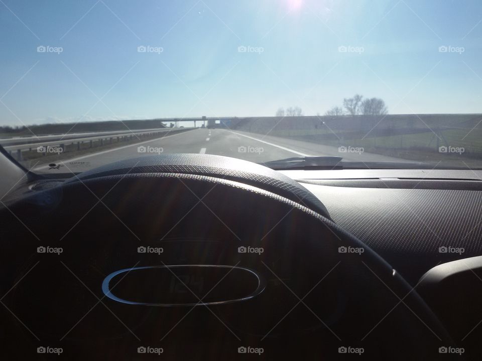 in the car through the windshield, higway