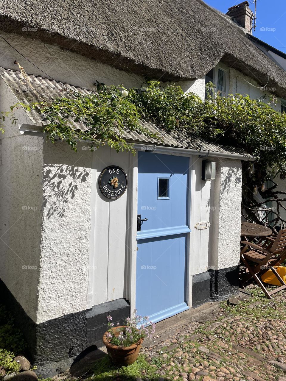 Blue stable door on a thatched fisherman’s cottage in Hope Cove 