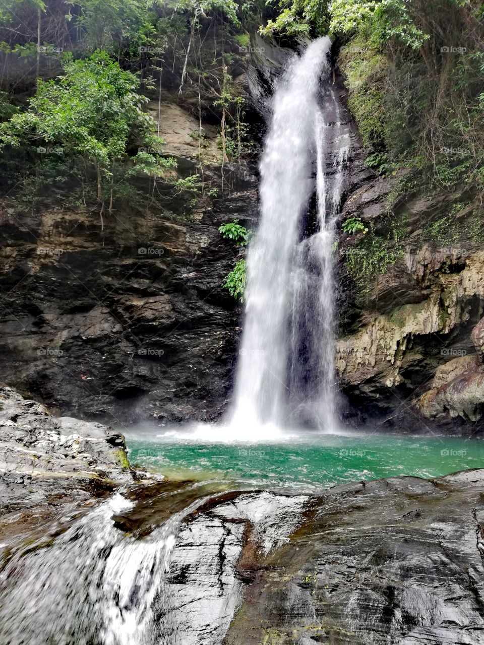 Agbalala waterfall in Abra De Ilog, Mindoro, Island of Philippines, hidden waterfall in tropical rainforest
