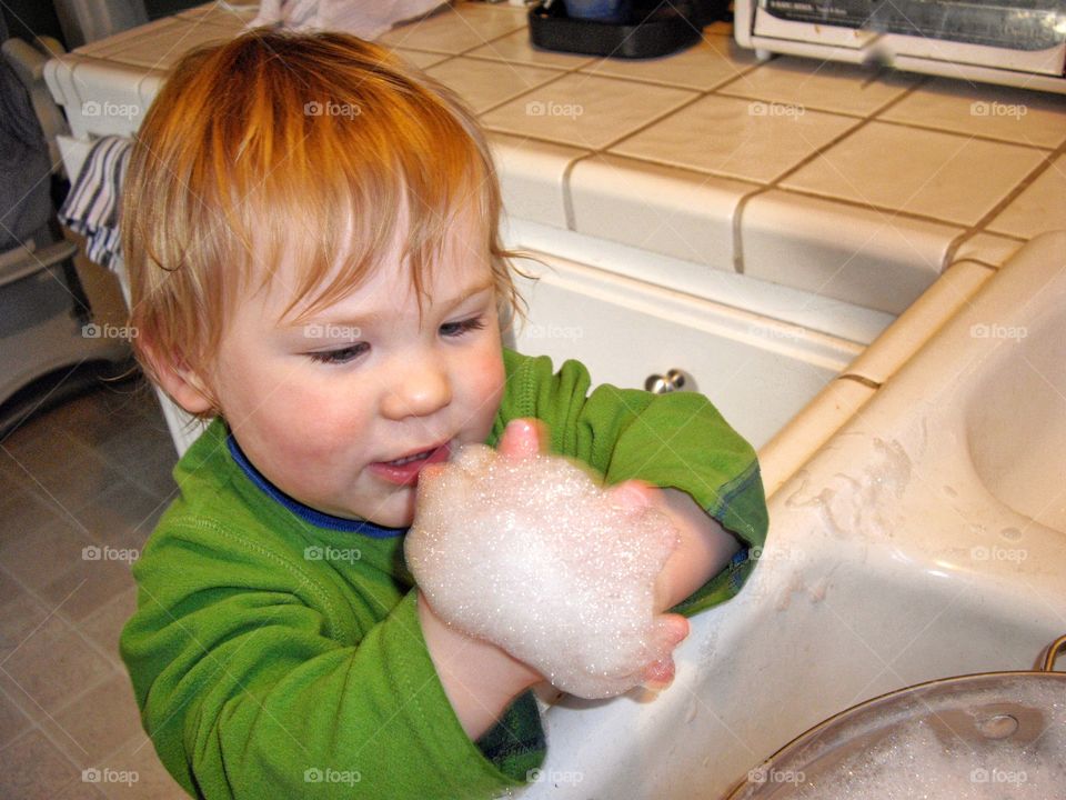 Young Boy Washing His Hands
