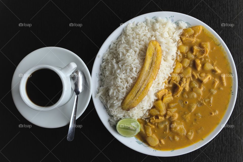 Typical food from ecuador guiso with plantain and coffee