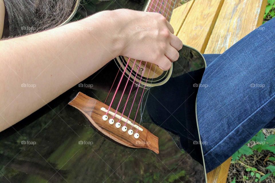 Strumming guitar