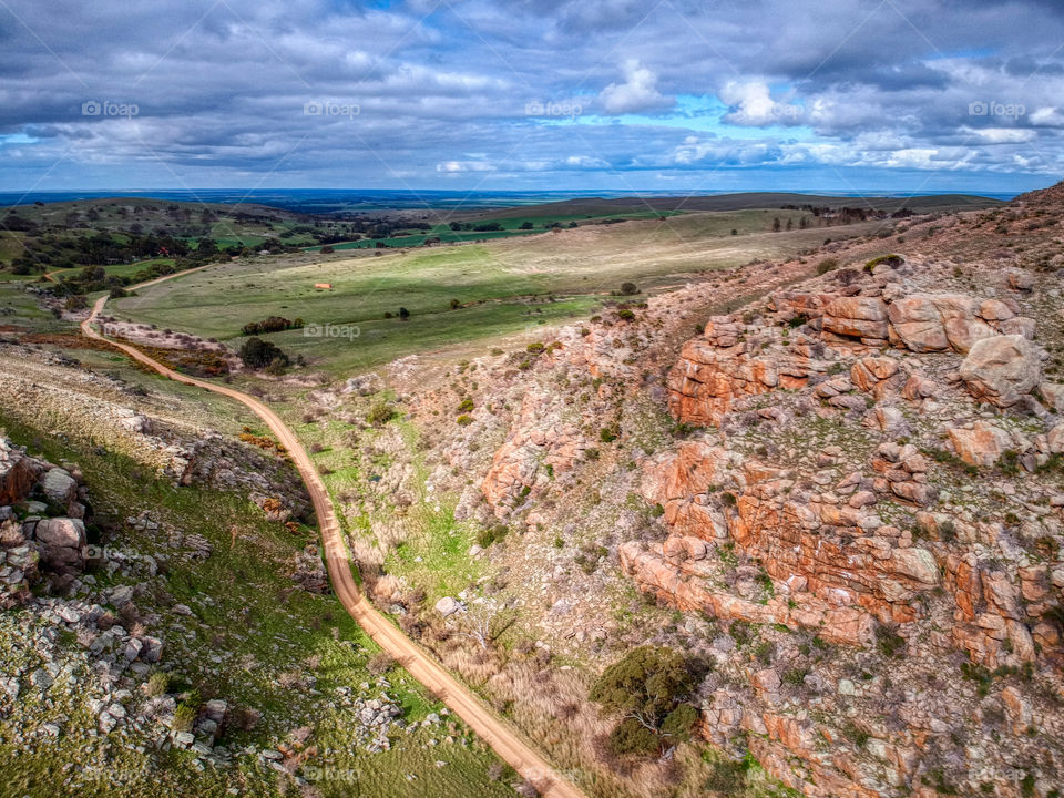 The Gap. A dirt road between two rocky hills. 